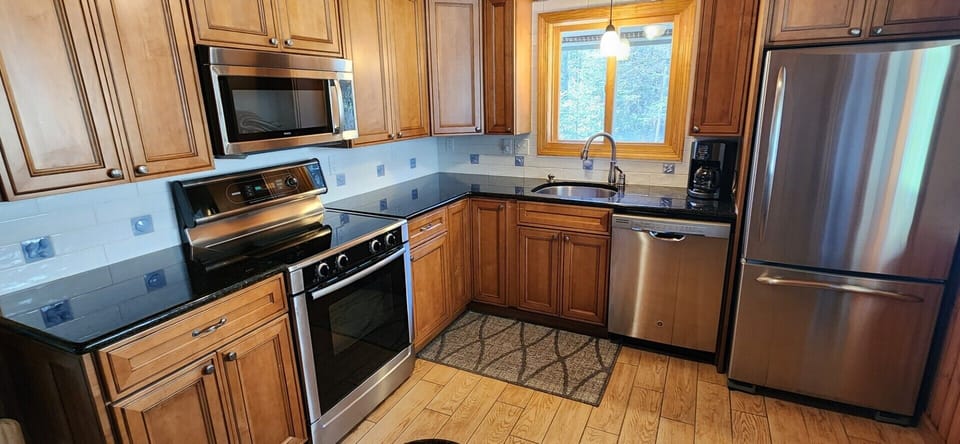 High end stainless steel appliances and granite countertops