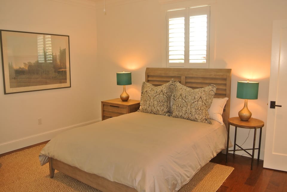 Bedroom Two with queen size bed, dresser and closet