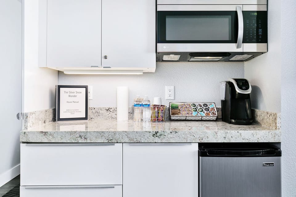 Snacks, waters, and keurig 2.0 coffee machine with pods