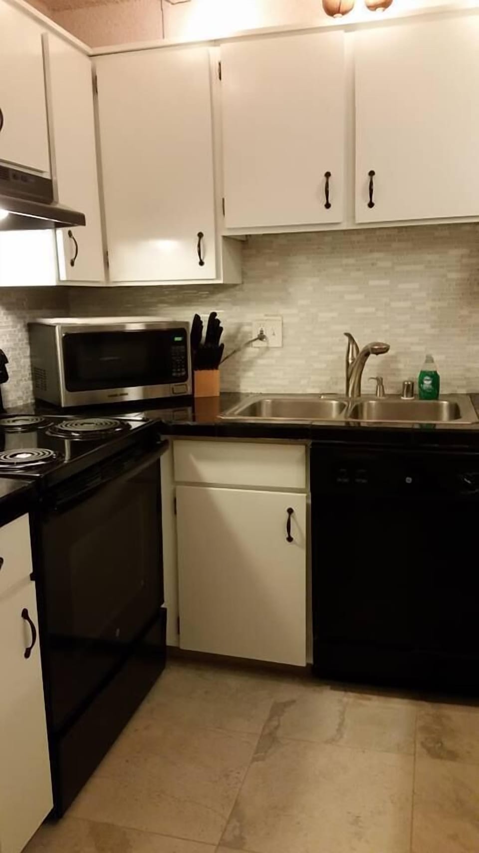 Full size kitchen is well stocked.