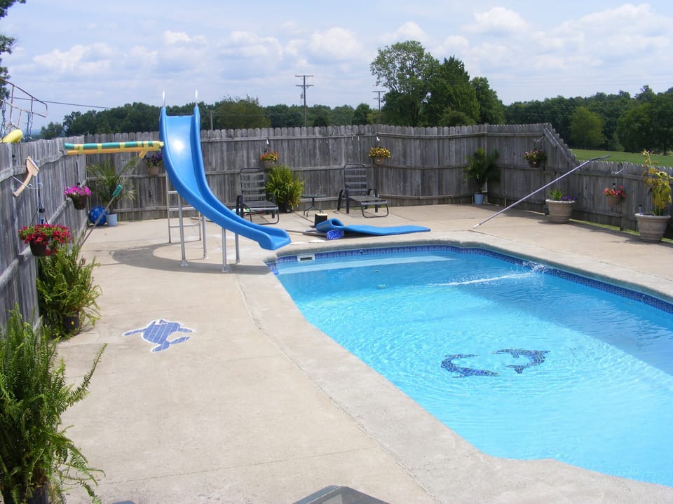 pool with slide and waterfall,tropical plants,, taken 8 7 2014