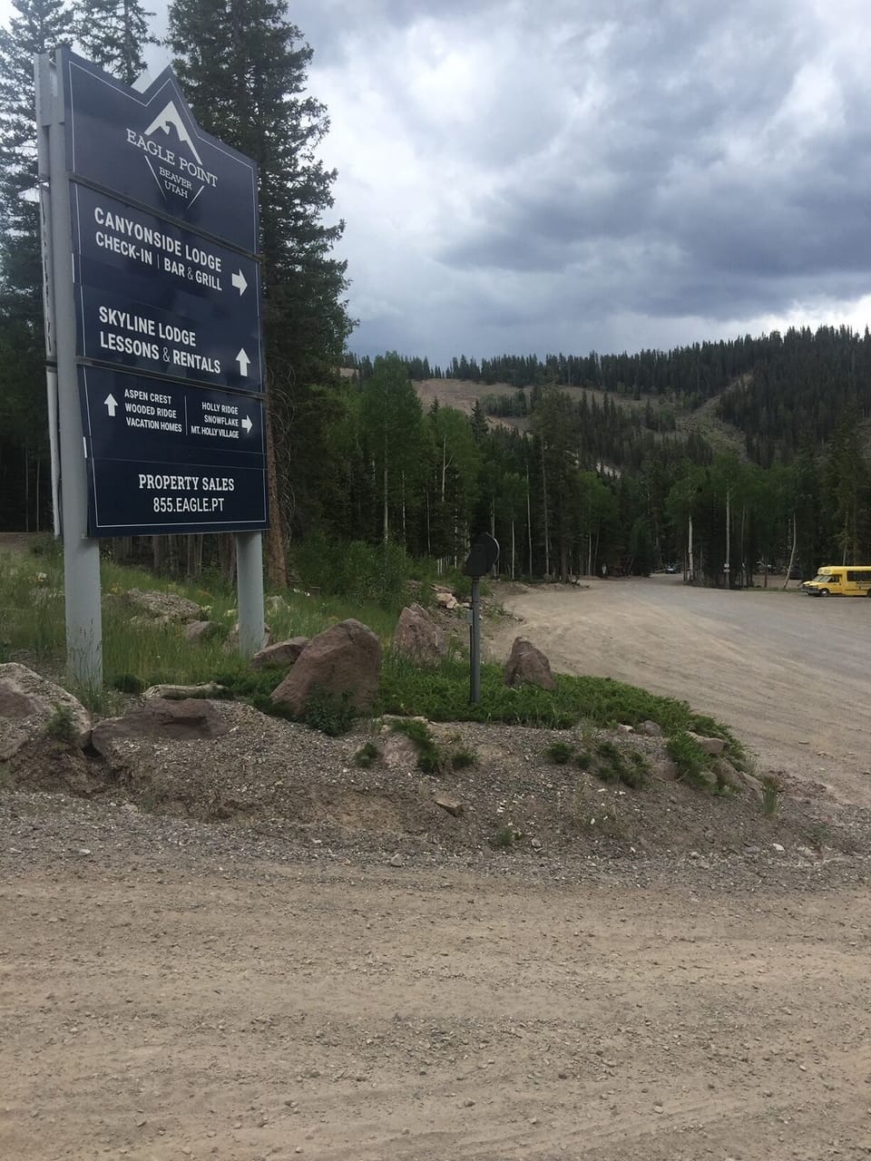 WHEN DRIVING UP, TURN RIGHT AT THIS SIGN AND DRIVE THROUGH THE LODGE PARKING LOT