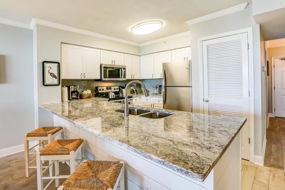 Granite counters, stainless appliances & wood tile floors are featured updates.