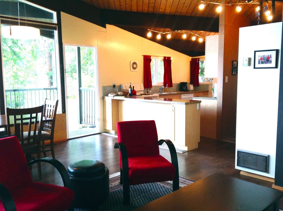 A easy space for meals and conversation.  Old photo with red chairs.