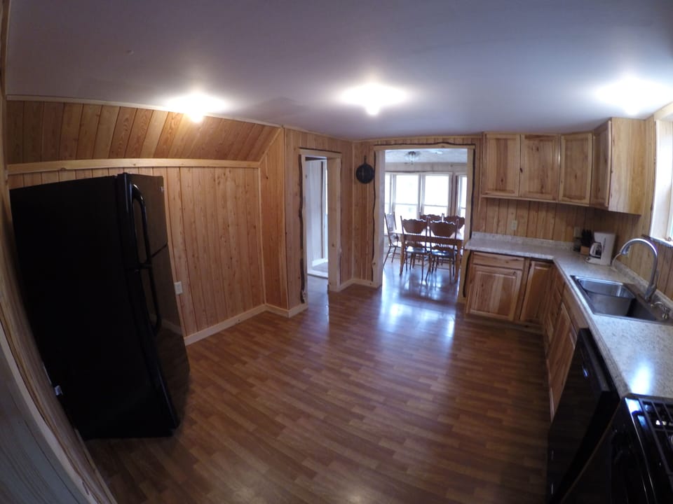 This spacious kitchen is finished in larch  from neighboring Elk County
