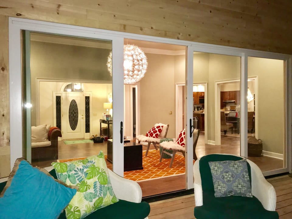 Huge 16 Foot Doors Open On To The Brand New Screened in Porch