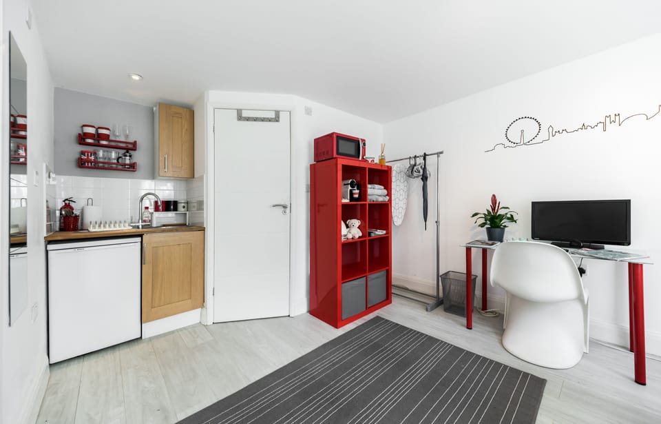 Studio room, kitchenette, clothes rail, shelves, desk, TV