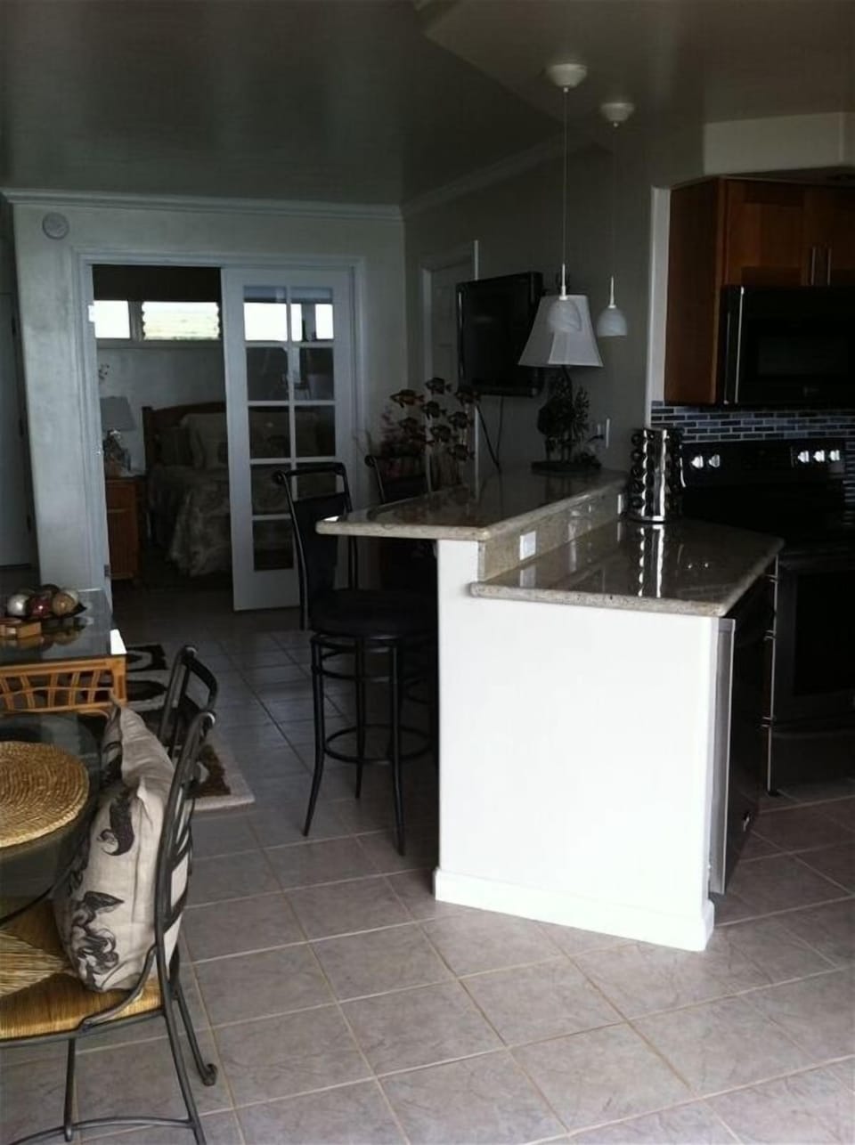 Enjoy the granite bar. Perfect for enjoying the ocean view from indoors.
