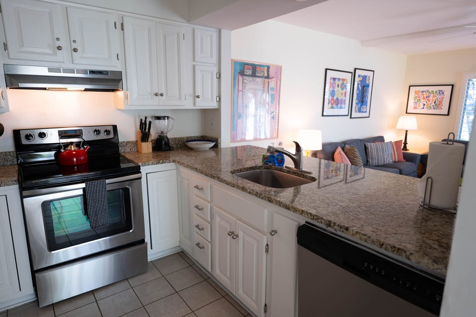 Kitchen is bright and overlooks the living area