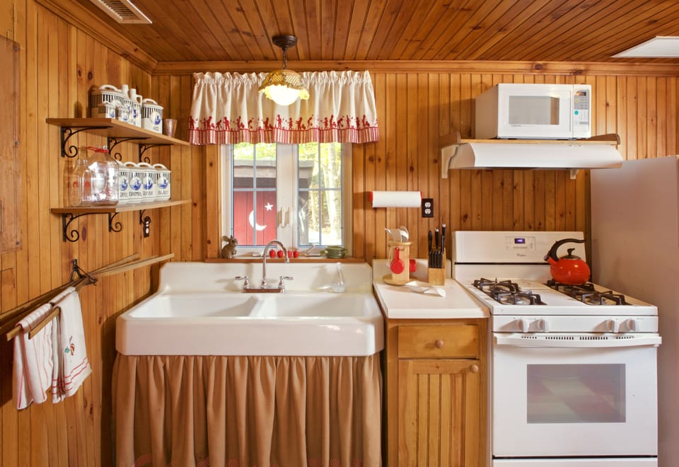 Terrific farmers sink, gas stove, microwave above.