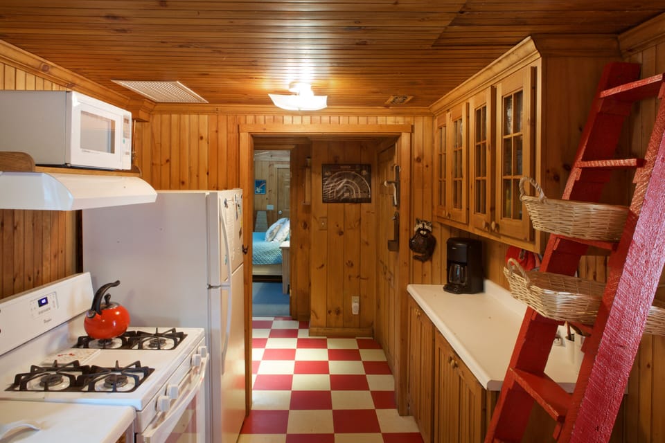 Galley style kitchen well equipped with all the basics.