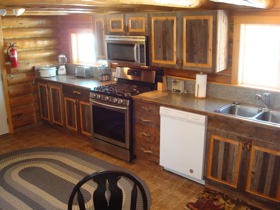The fully equipped kitchen has a stainless gas stove & all you need for cooking.