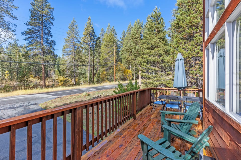 Sunny deck of the living room with dining and chairs to relax