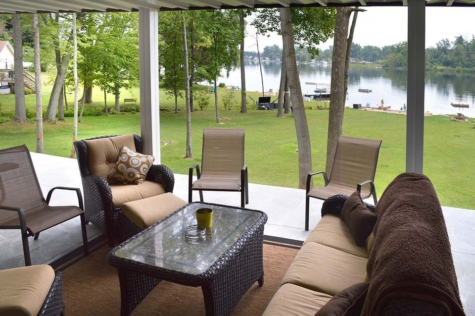 Covered patio with comfy furniture makes a great place to get out of the sun