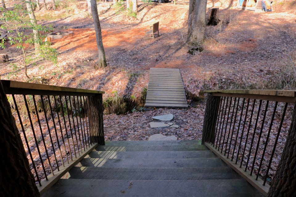 shelter steps and bridge across the creek to the main camping area