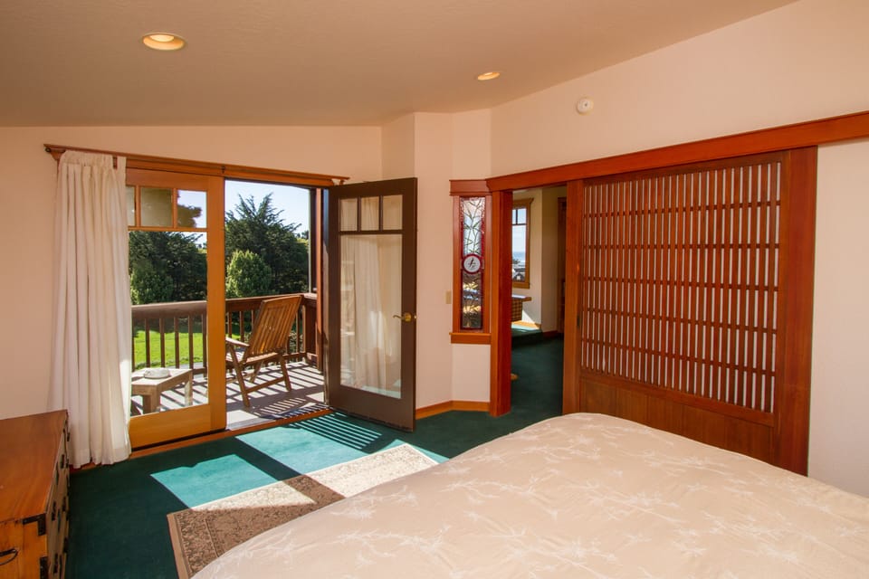 Bedroom and with a view of the balcony entrance