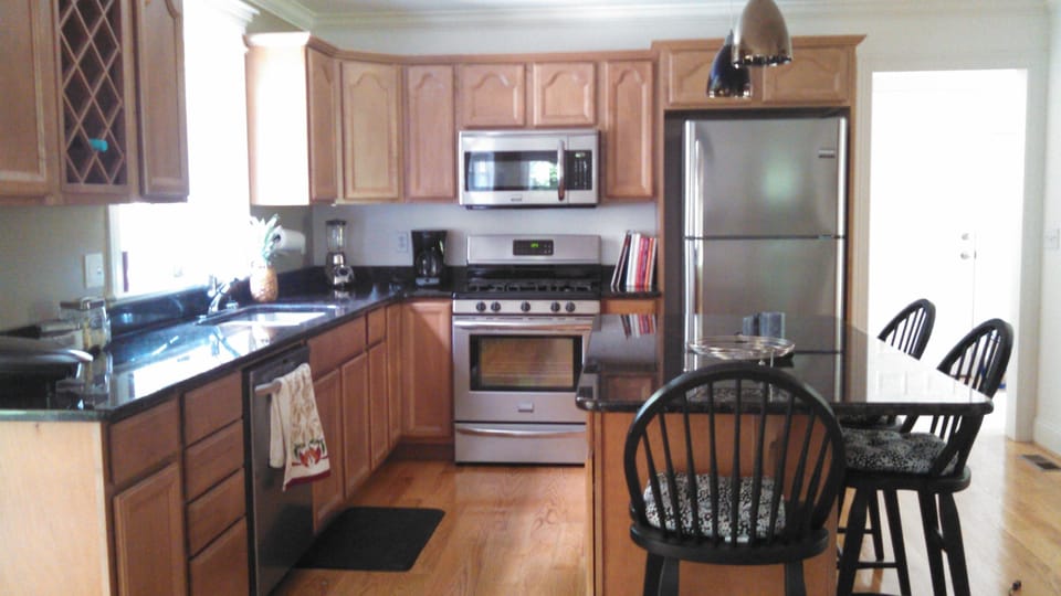 kitchen with island which is open to livingroom