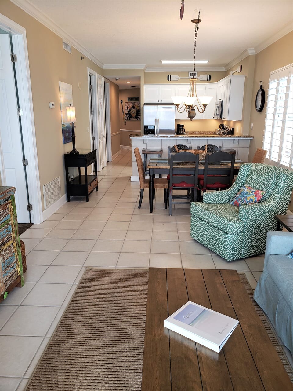 View of living room from the sliding glass doors to the beach side balcony
