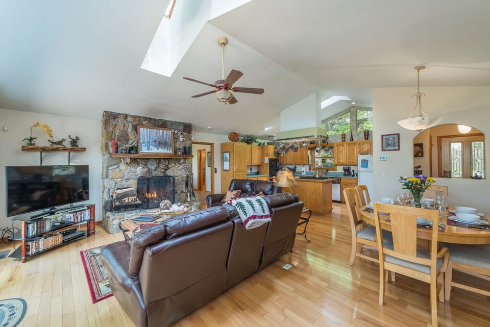Relax in front of the wood burning fireplace while you watch your favorite shows