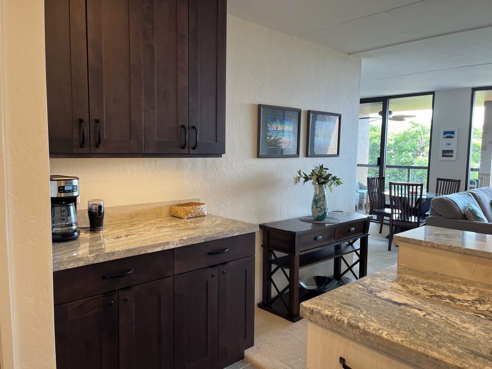 Kitchen and coffee bar open into the living/dining area.
