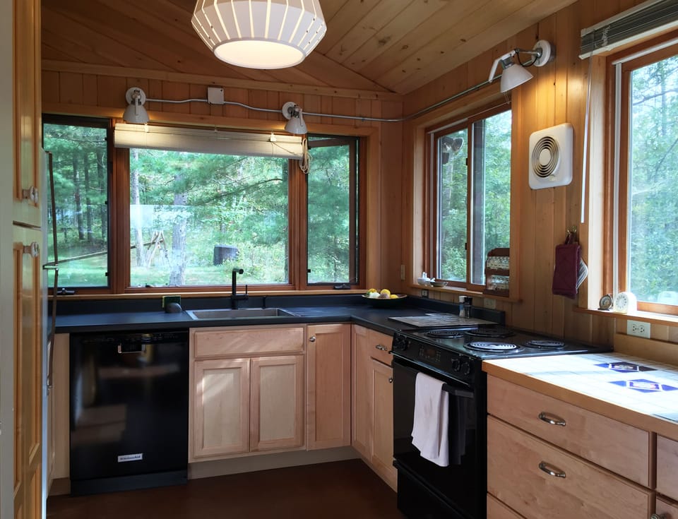 Well stocked kitchen with views to nature everywhere you look