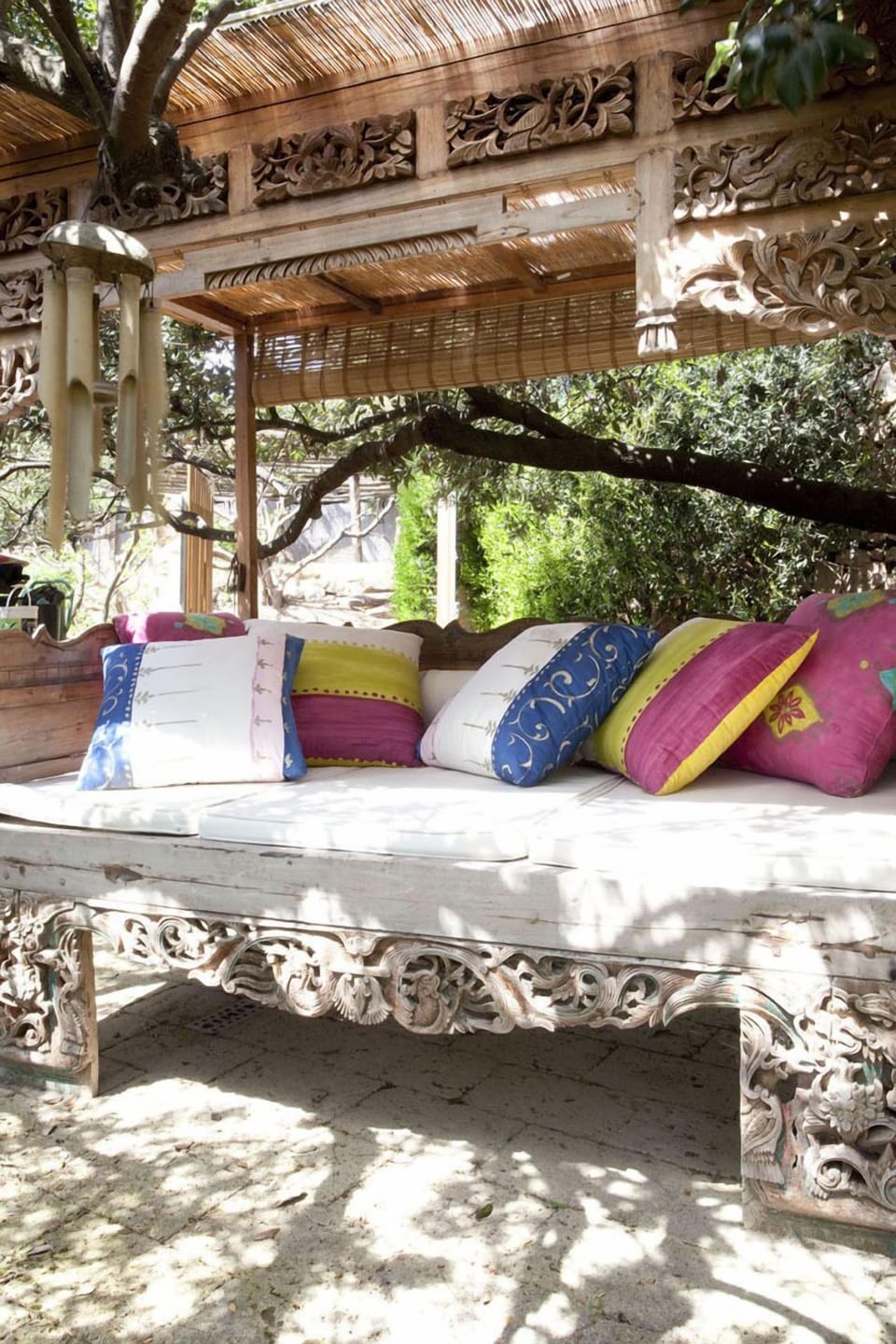 Indonesian daybeds in the garden under the trees