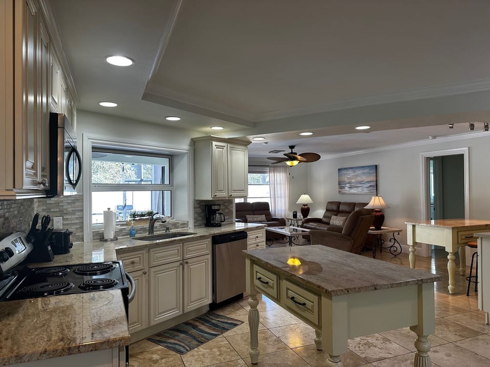 Large Open Kitchen Centrally Located Between Family Room, Living & Dining Areas