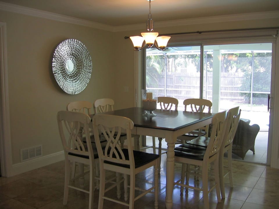 Dining Room with Direct Access to Pool and Lanai.  Seats 8 people
