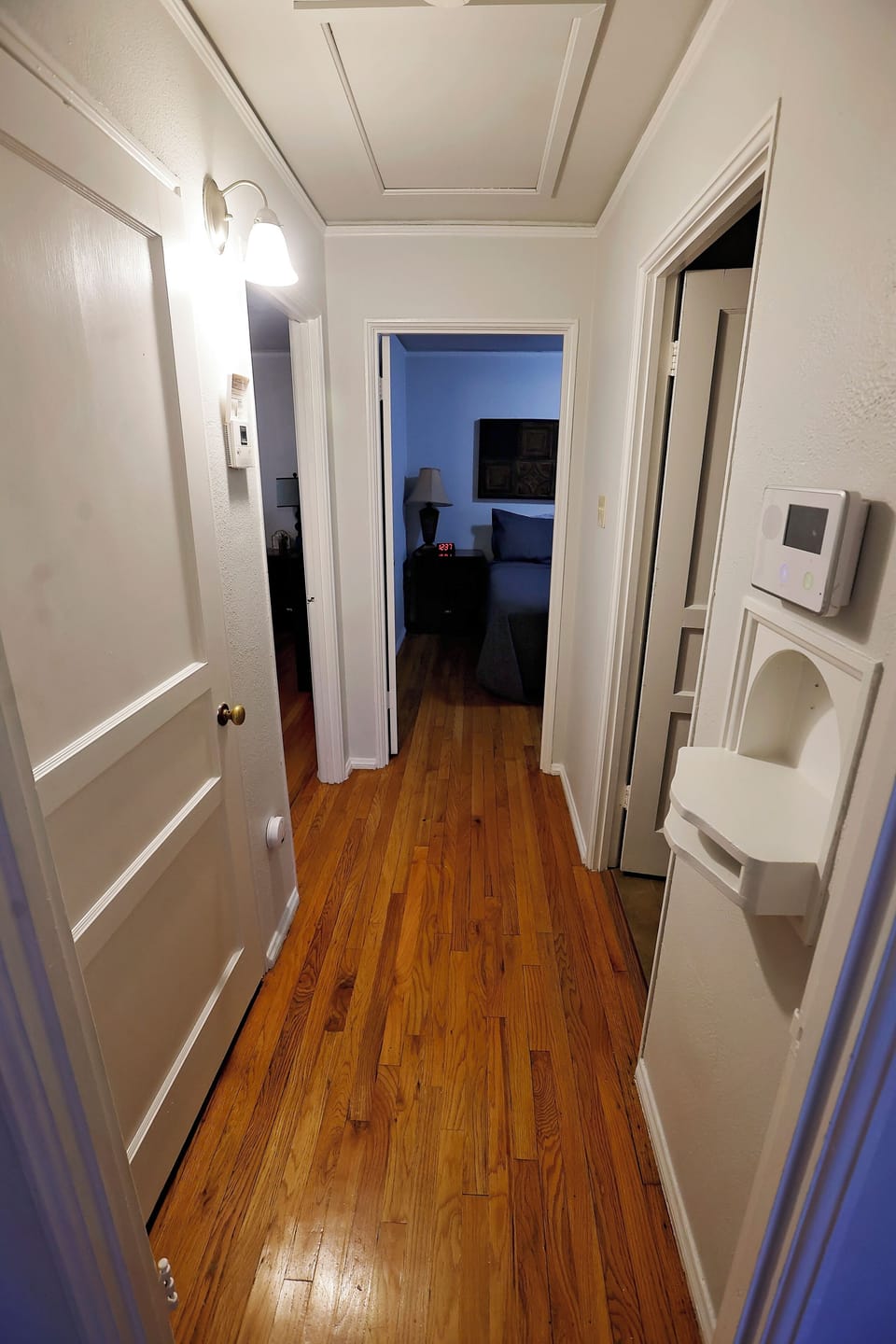 Bright, clean hallway connecting the living spaces with a welcoming feel.