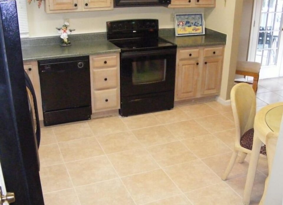 Eat In Kitchen with NEW 17" tile flooring & conveniences of home.