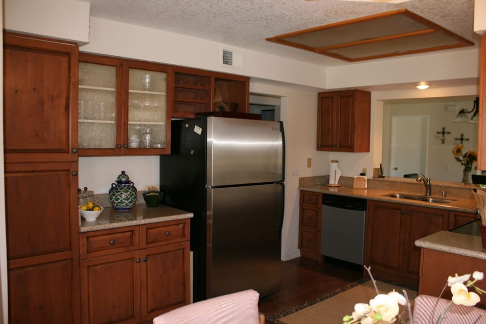 Re-modeled kitchen with granite counters and maple cabinets