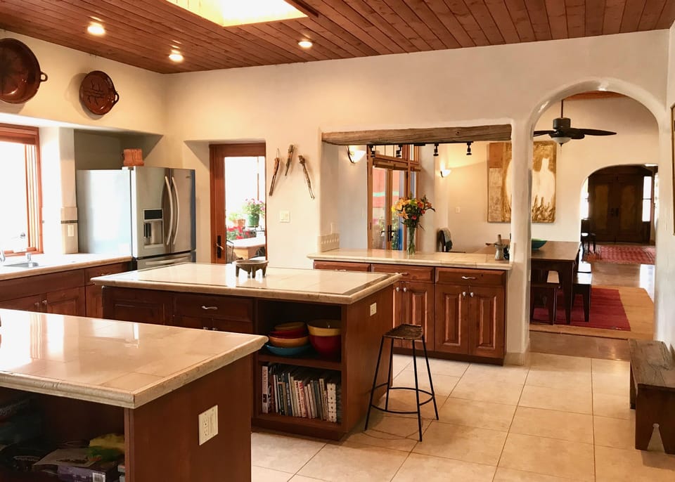 Kitchen, looking toward the entry way and bedroom area