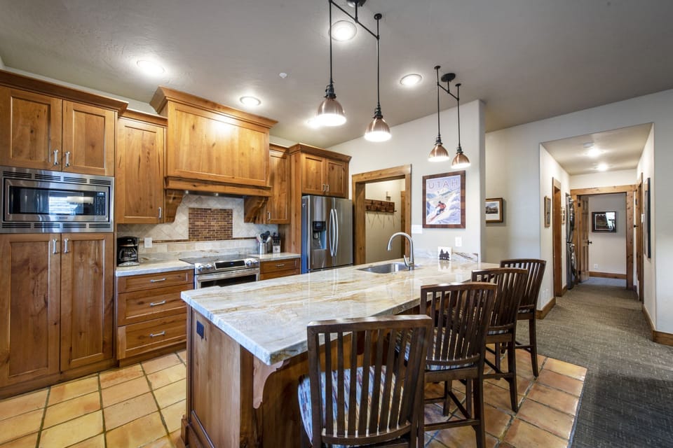 Granite kitchen counter with four stools
