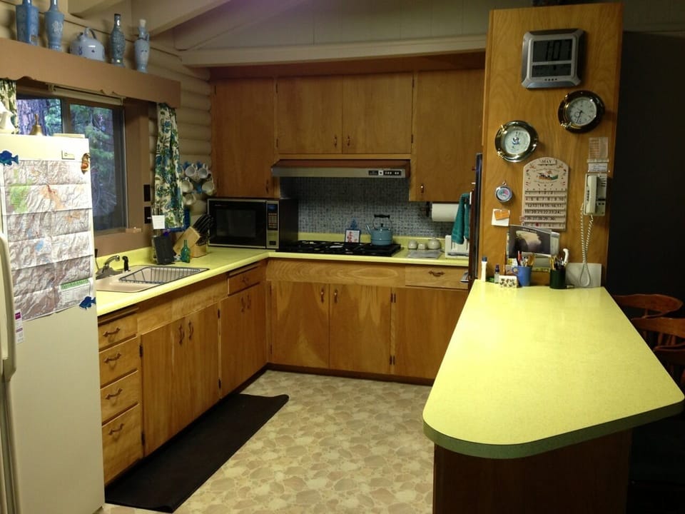 Full kitchen and breakfast bar.  Vintage decor throughout cabin.