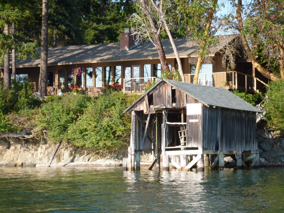 Vintage boathouse sets off architecture of  classic Northwest Contemporary house