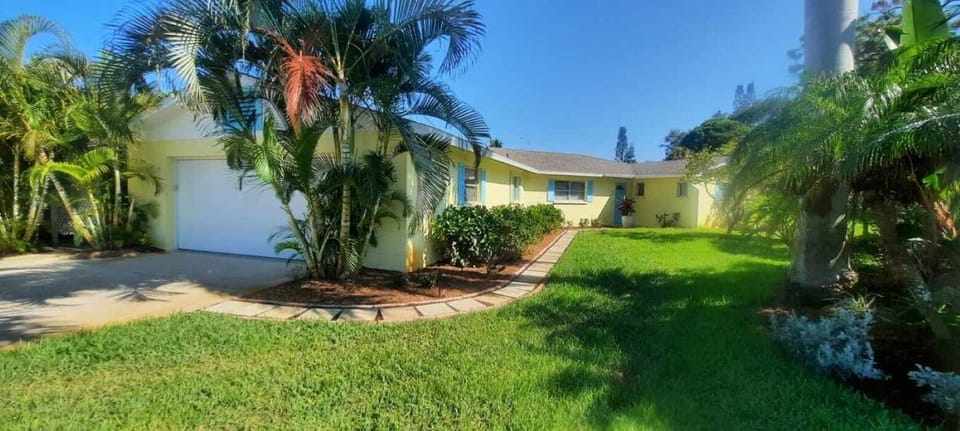 Front door of home, double garage and large driveway