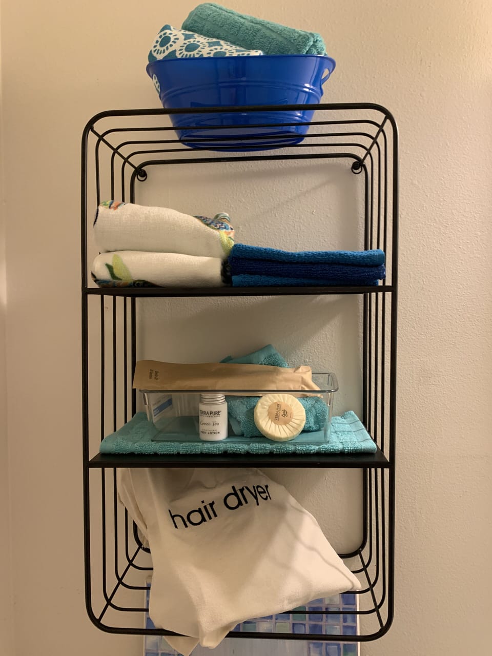 Half Bath hair dryer and toiletries

