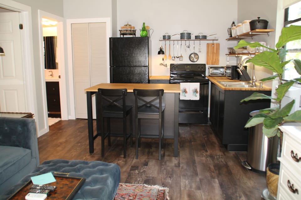 fully stocked kitchen, cuisinart pots + pans, all you need to bring is the food.