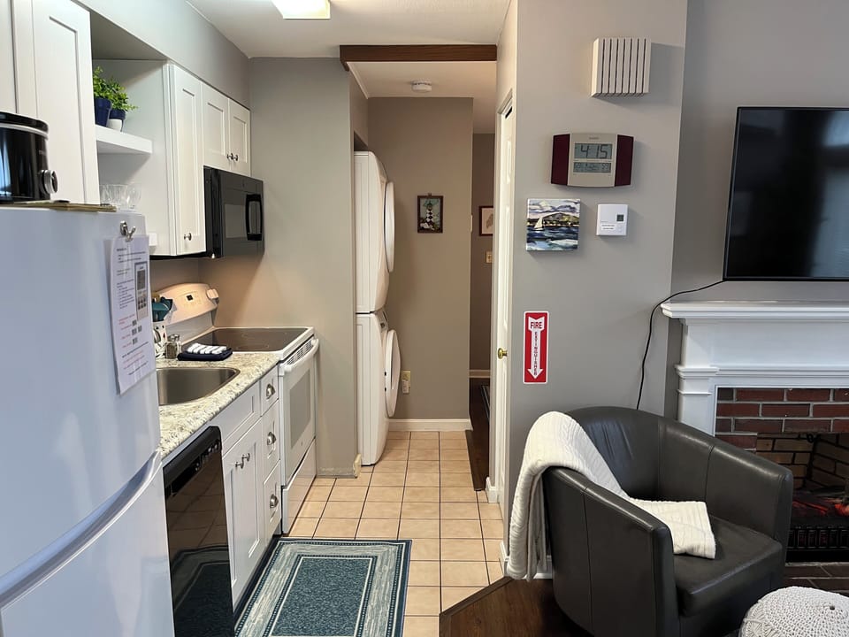 View of kitchen and high-efficiency washer/dryer.