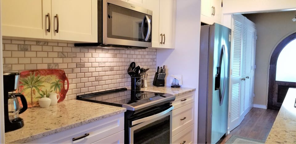 All new stainless appliances -- microwave, smooth-top oven, dishwasher, fridge
