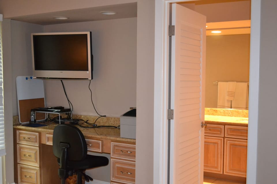2nd Bedroom with desk, flat screen TV and adjoining bathroom
