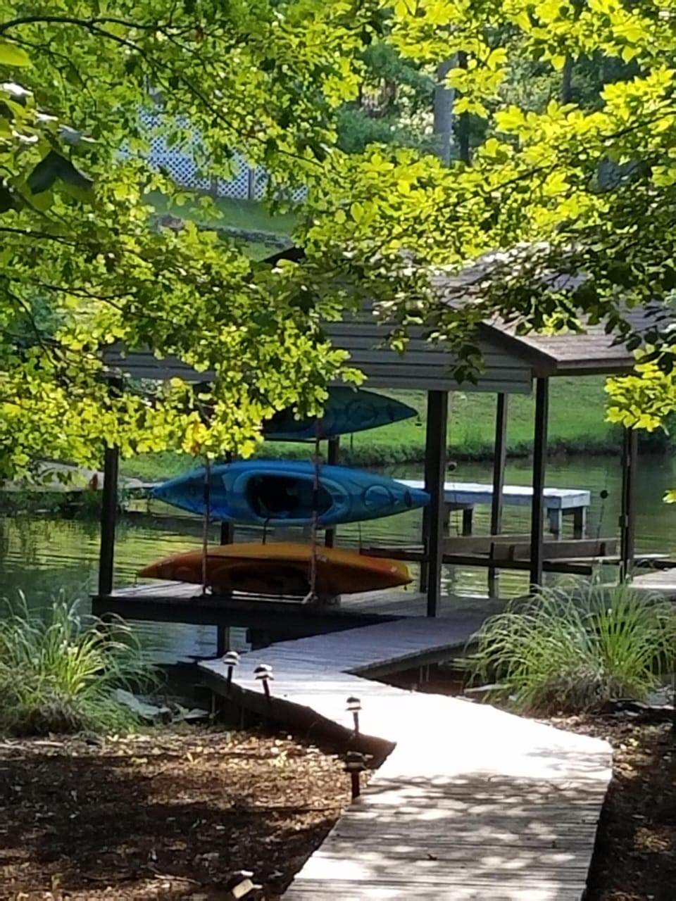 Kayaks for guest use and a shot of our boathouse with public dock next to it. 