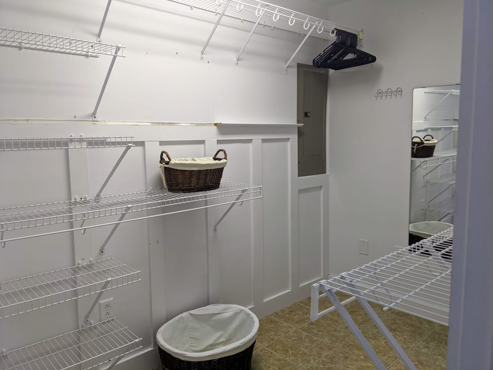 Walk-in closet off the primary bedroom. VRBO enlarged all photos..we apologize 
