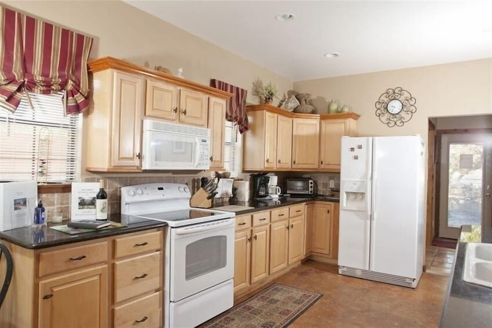 Kitchen with fridge and stove 