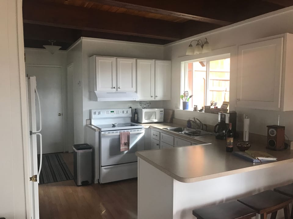 Kitchen that opens to dining and living space