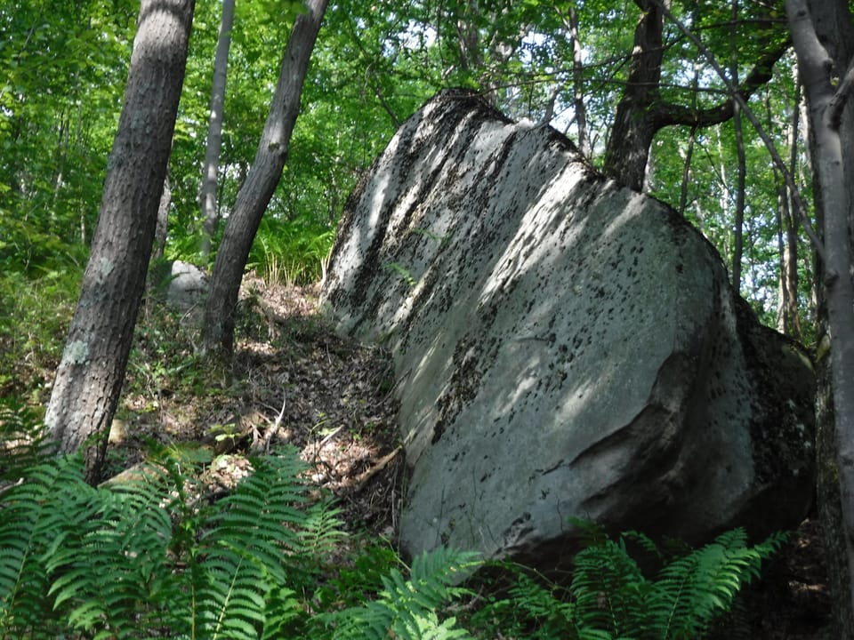 Walk the trail on 6 acres to view boulders.