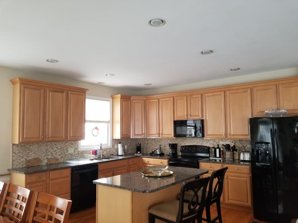 kitchen, granite counters, island, black appliance, electric range, dishwasher
