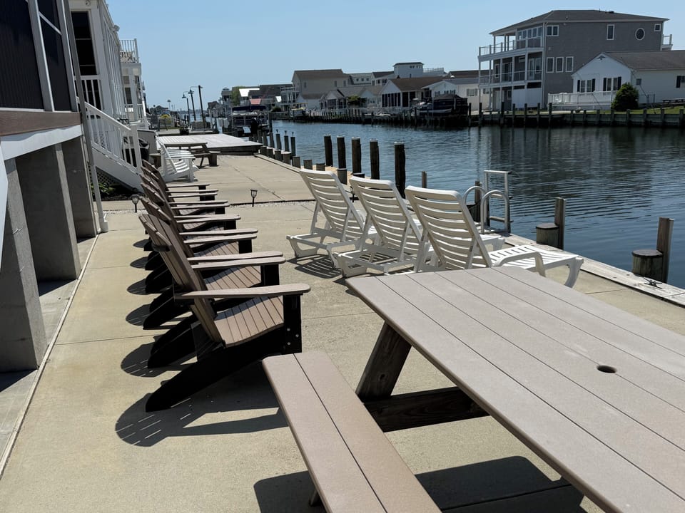 Picnic table, 6 chairs, 3 lounges and boat dockage