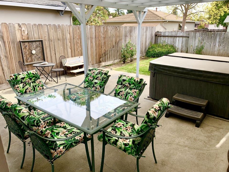 Private fenced yard, covered patio with a NEW  Spa