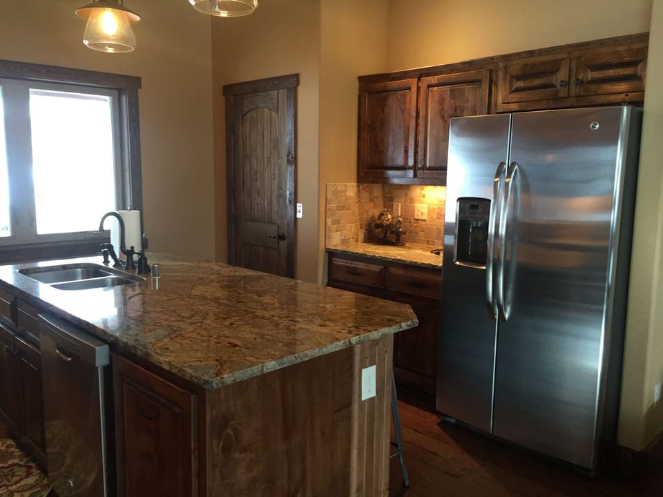 Kitchen with granite countertops and stainless appliances.